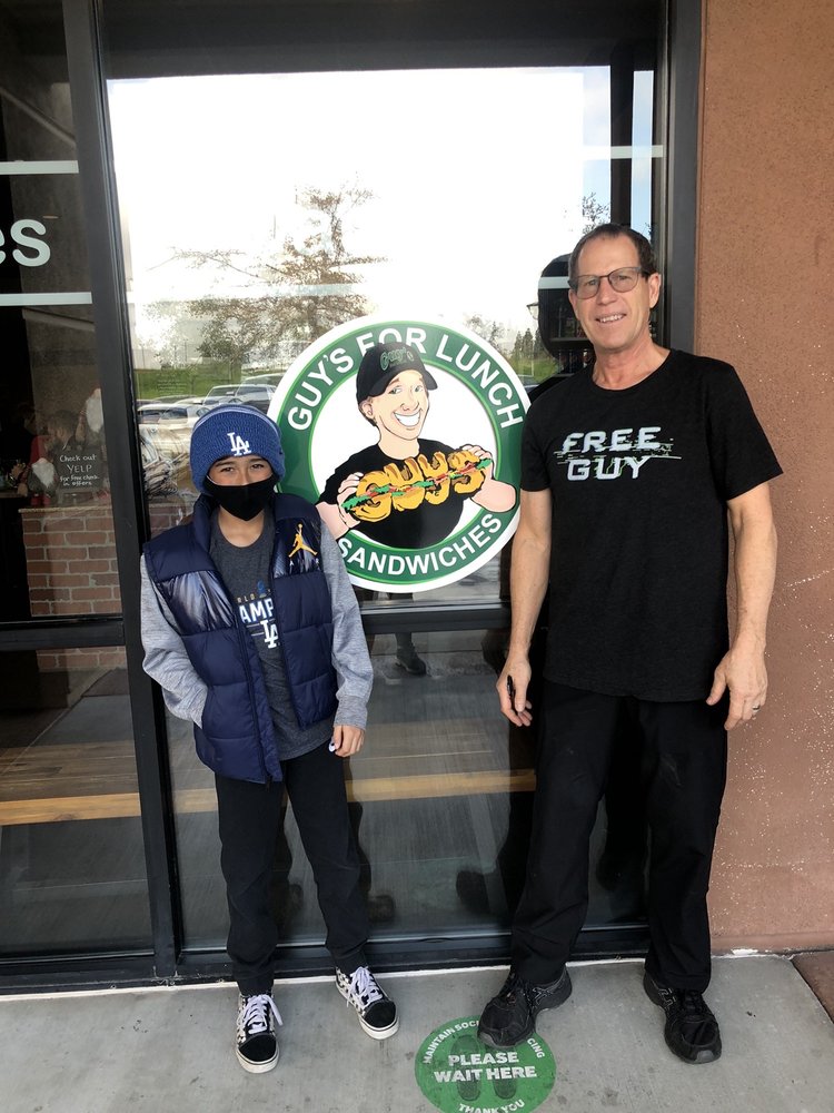 The owners of Guy's For Lunch outside their Roseville sandwich shop